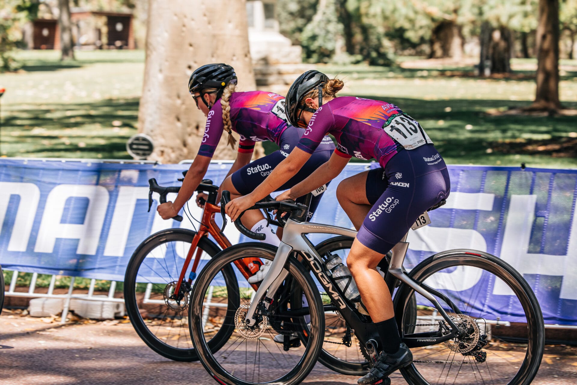 Junior cyclists training together outdoors