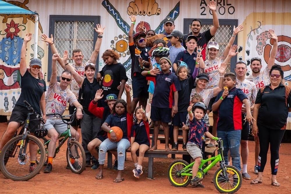 Participants, volunteers and organisers at the old Laverton youth centre after a community riding session